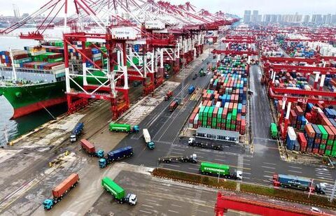 A cargo ship docked at a port with loaded containers. (AFP)