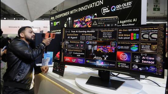 Global PC shipments decline after nine positive quarters as memory crunch deepens A visitor takes photo of a True AI Gaming Monitor at the Computex Taipei exhibition in Taiwan on June 2. (AP)