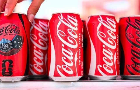 Coca-Cola beats earnings as World Cup sales boost revenue, raises 2026 forecast, while Fairlife resumes production after ransomware cyberattack. (Photo by Patrick T. Fallon / AFP) (AFP)