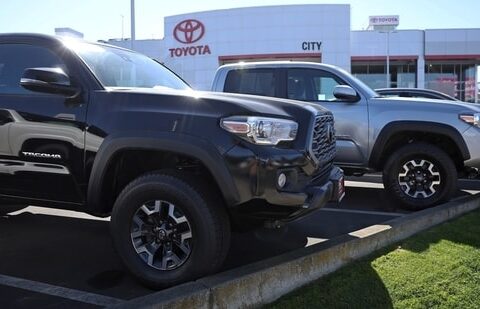 DALY CITY, CALIFORNIA - FEBRUARY 28: Toyota Tacoma trucks are displayed on the sales lot at City Toyota on February 28, 2024 in Daly City, California. Toyota announced plans to recall nearly 381,000 Toyota Tacoma pickup trucks due to an issue with parts falling off the rear axle that could result in a crash. (Photo by Justin Sullivan/Getty Images)