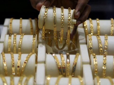 Gold price today: Check 22K, 24K rates in Delhi, Bengaluru, Chennai and Mumbai A salesman arranges gold bangles inside a jewellery showroom. (REUTERS)