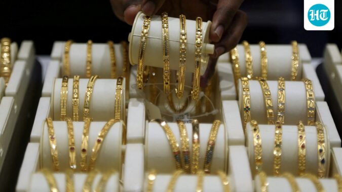 Gold price today: Check 22K, 24K rates in Delhi, Bengaluru, Chennai and Mumbai A salesman arranges gold bangles inside a jewellery showroom. (REUTERS)