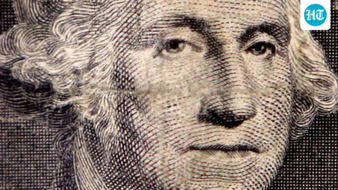 Gold, code and the rupee: Inside the quiet war over how the world will pay The image of first US president George Washington on a dollar bill is seen in a photo illustration. (Reuters)