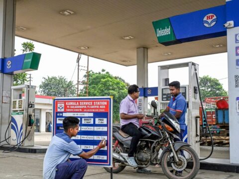 A worker updates prices at a petrol pump in Nadia, West Bengal. (PTI File Photo)