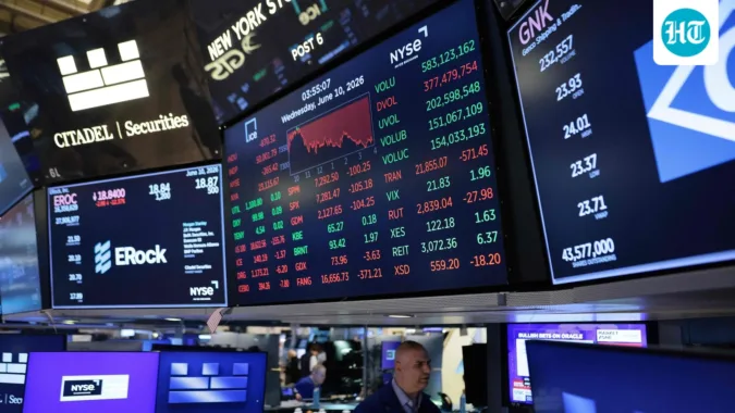 S&P 500 correction risk rises as sticky inflation, Trump tariffs and possible Fed rate hikes threaten the stock market after strong 2026 gains. (Photo by Michael M. Santiago / GETTY IMAGES NORTH AMERICA / Getty Images via AFP) (Getty Images via AFP)