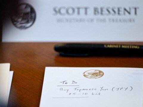 A notepad in front of Treasury Scott Bessent from a July 31 cabinet meeting at Camp David.