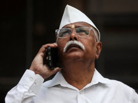 File photo: A man looks at a screen outside the Bombay Stock Exchange (BSE) building in Mumbai (REUTERS)