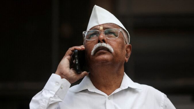 File photo: A man looks at a screen outside the Bombay Stock Exchange (BSE) building in Mumbai (REUTERS)