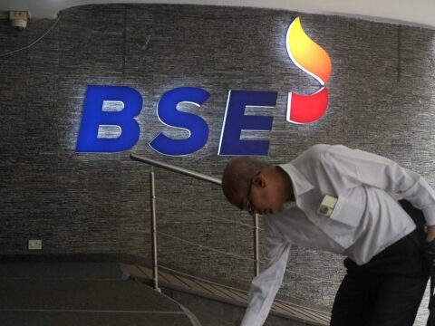 Sensex, Nifty open higher amid sharp drop in crude oil prices A man touches the stairs as he arrives at the Bombay Stock Exchange (BSE) building in Mumbai (REUTERS/File)