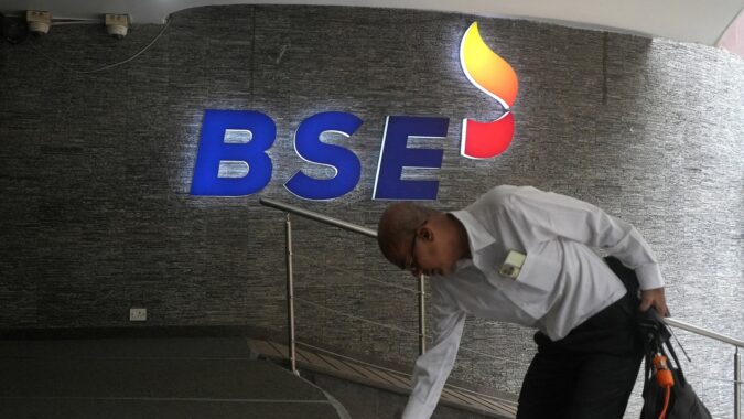 Sensex, Nifty open higher amid sharp drop in crude oil prices A man touches the stairs as he arrives at the Bombay Stock Exchange (BSE) building in Mumbai (REUTERS/File)