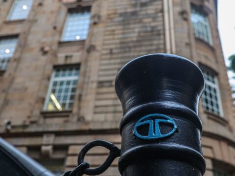 The Tata Group logo is displayed on a pedestrian safety pole near Bombay House, the Tata Group headquarters building, in Mumbai. (Representative Image/Bloomberg)