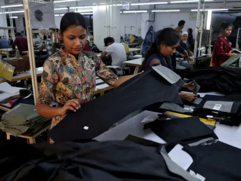 FILE PHOTO: FILE PHOTO: Workers check trousers at a garment manufacturing unit on the outskirts of Ahmedabad, India, January 29, 2026. (REUTERS)