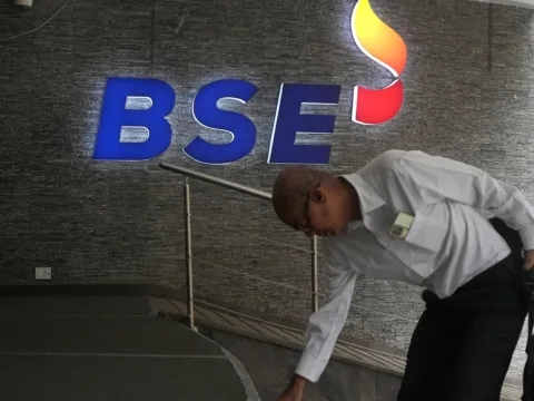 Sensex, Nifty open flat as Middle East tensions keep crude above $100 A man touches the stairs as he arrives at the Bombay Stock Exchange (BSE) building in Mumbai (REUTERS/File)