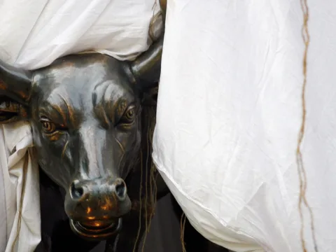 Sensex, Nifty open positive amid Middle East concerns, fund outflows File photo: A bronze replica of a bull is seen at the gates of the Bombay Stock Exchange (BSE) building in Mumbai (REUTERS)