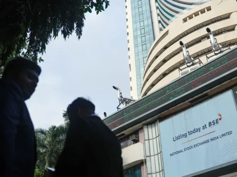 Signage marking the listing of National Stock Exchange of India Ltd. (NSE) displayed at the Bombay Stock Exchange (BSE) in Mumbai on Sept 24 (Bloomberg)