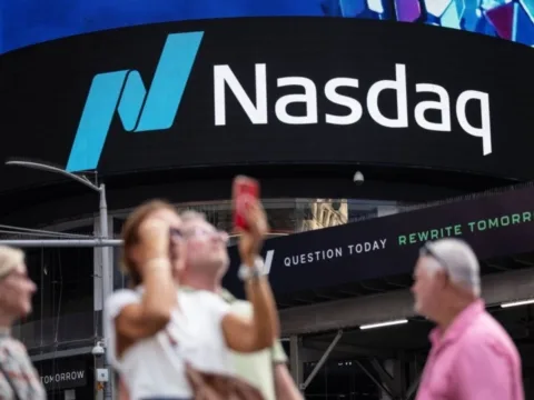 Nasdaq hits record high as oil prices fall and US-Iran talks lift market sentiment.