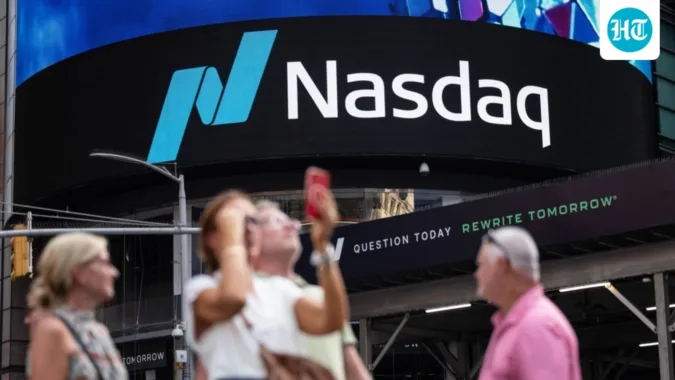 Nasdaq hits record high as oil prices fall and US-Iran talks lift market sentiment.