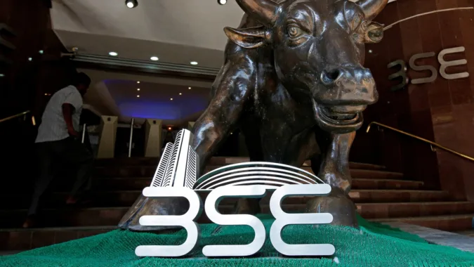 Stock market today: Sensex, Nifty see positive start; NSE IPO receives 6x subscription on final day File Photo: The Bombay Stock Exchange logo is seen under a bull statue at the entrance of their building in Mumbai (REUTERS)