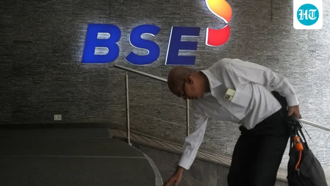 Stock market today: Sensex, Nifty open higher amid crude price pullback; Tata stocks in focus A man touches the stairs as he arrives at the Bombay Stock Exchange (BSE) building in Mumbai (REUTERS/File)
