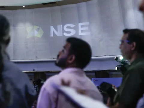 The National Stock Exchange of India Ltd. (NSE) logo on display during the company's listing ceremony at the Bombay Stock Exchange (BSE) in Mumbai on Sept 24 (Bloomberg)