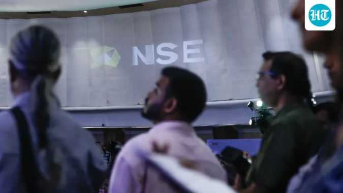 The National Stock Exchange of India Ltd. (NSE) logo on display during the company's listing ceremony at the Bombay Stock Exchange (BSE) in Mumbai on Sept 24 (Bloomberg)