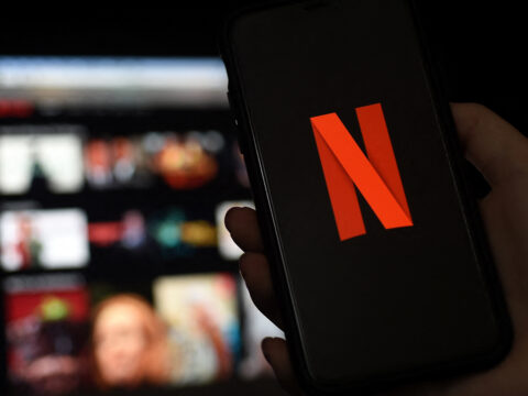 In this file photo illustration a computer and a mobile phone screens display the Netflix logo on March 31, 2020 in Arlington, Virginia. (AFP)