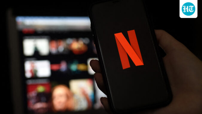 In this file photo illustration a computer and a mobile phone screens display the Netflix logo on March 31, 2020 in Arlington, Virginia. (AFP)