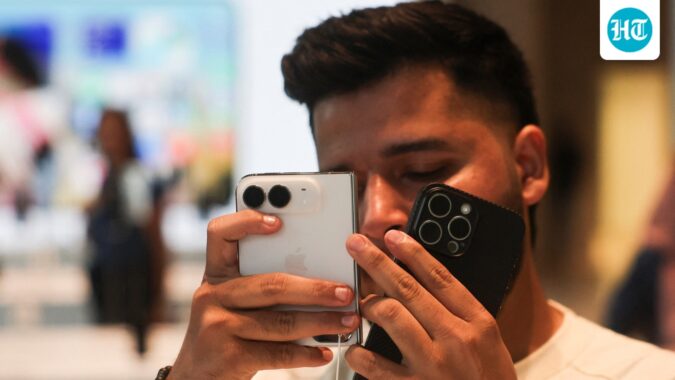 Apple iPhone Duo goes on sale in India at ₹2.99 lakh, buyers throng stores on launch day A customer uses Apple's new foldable iPhone Duo at the Apple store in Mumbai, India, October 23, 2026. (REUTERS)