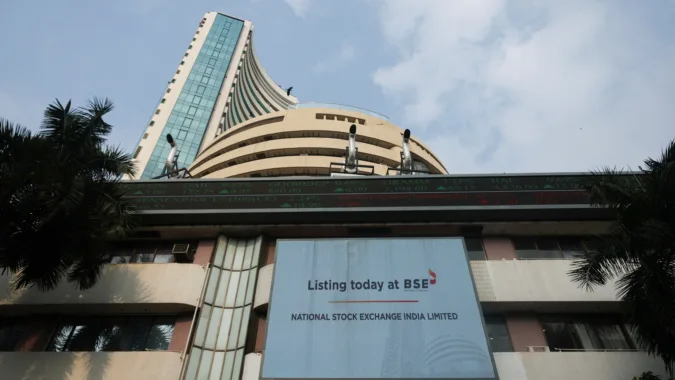 A screen displays a message of the National Stock Exchange (NSE) listing ceremony at the Bombay Stock Exchange (BSE) in Mumbai on September 24 (REUTERS/File)
