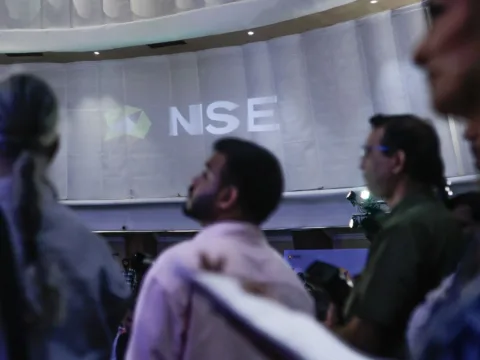 The National Stock Exchange of India Ltd. (NSE) logo on display during the company's listing ceremony at the Bombay Stock Exchange (BSE) in Mumbai on Sept 24 (Bloomberg)