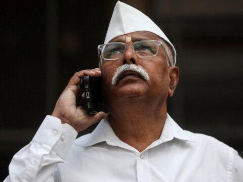 A man looks at a screen outside the Bombay Stock Exchange (BSE) building in Mumbai (Reuters File)